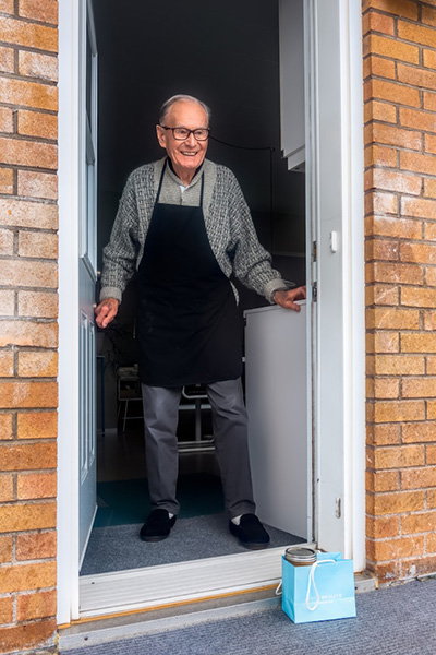 Older gentleman receiving deliveries