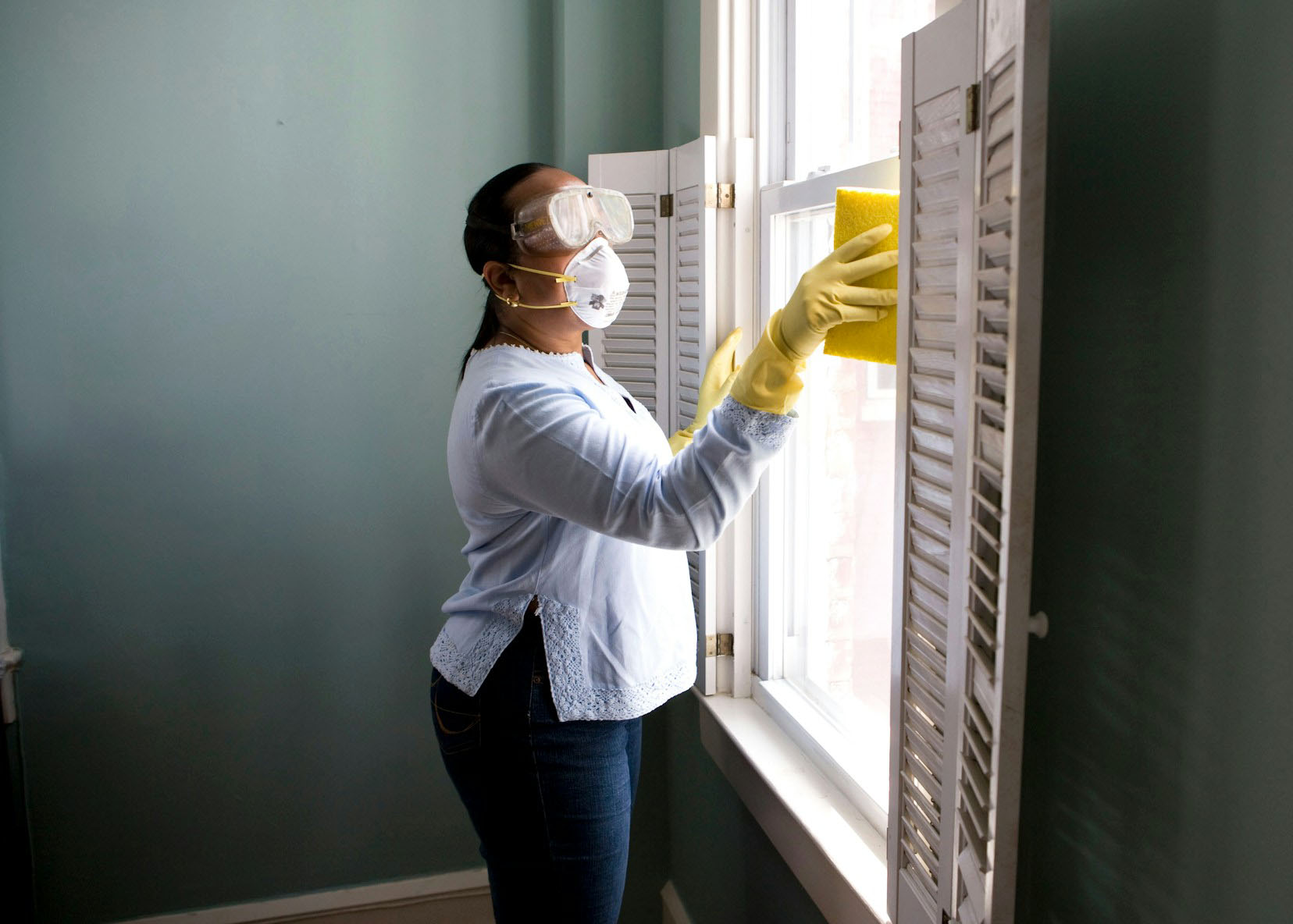 Worker cleaning a house